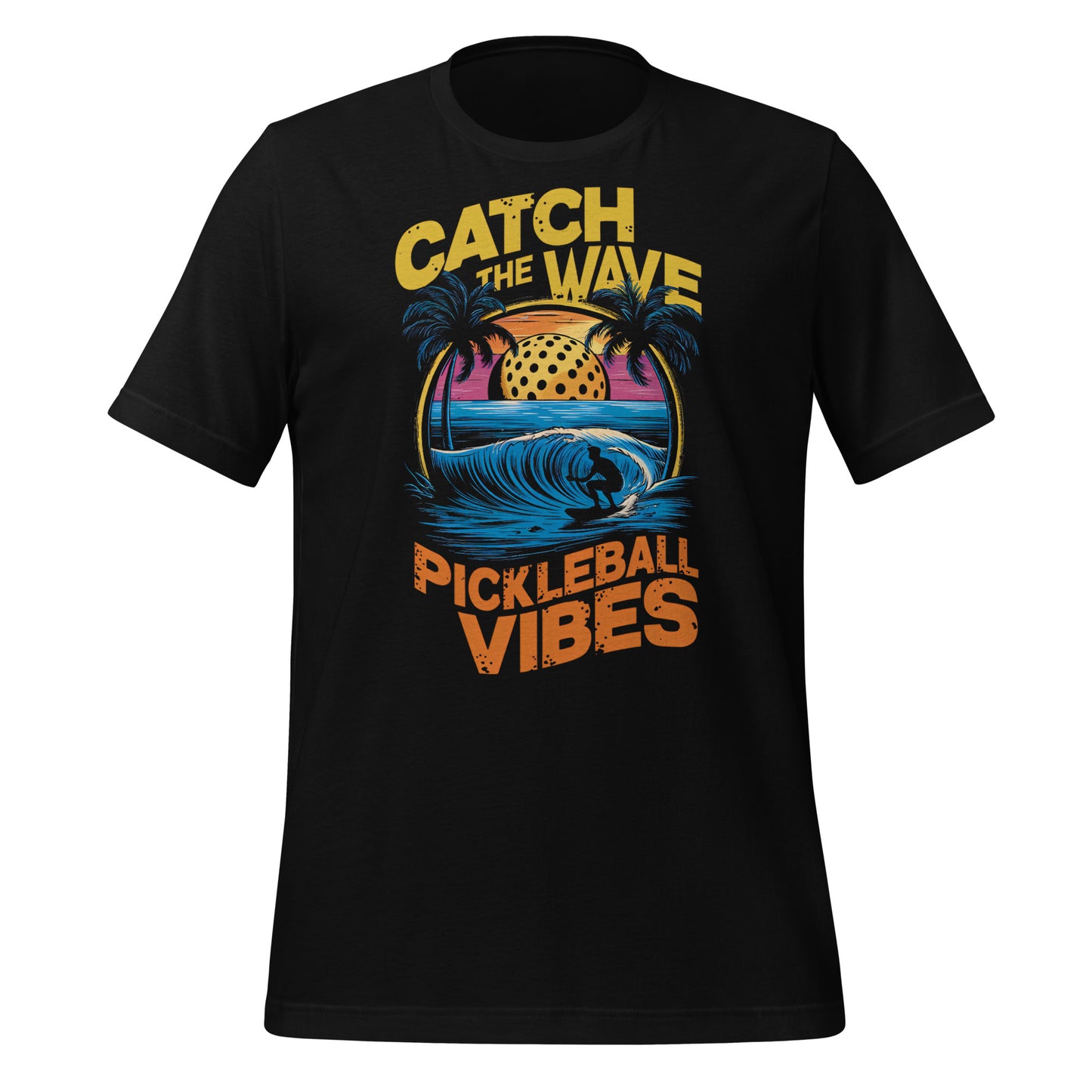 Black t-shirt with “Catch the Wave Pickleball Vibes” graphic featuring a surfer, pickleball, and palm trees.
