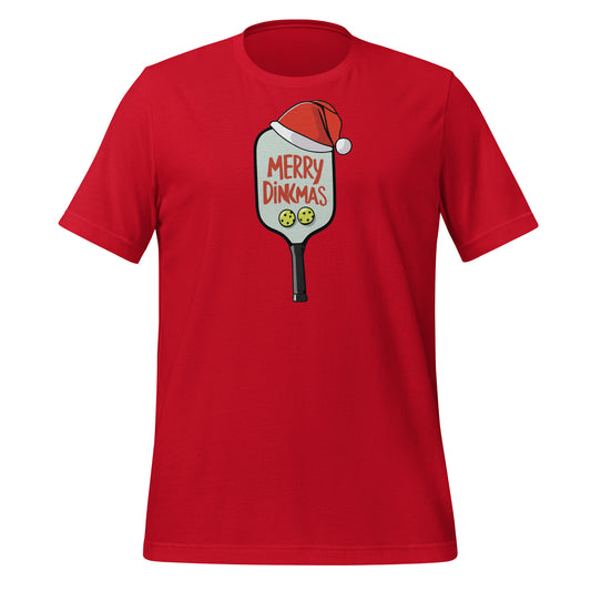Close-up of the “Merry Dinkmas” graphic on a black t-shirt, showing a Santa hat on a pickleball paddle.