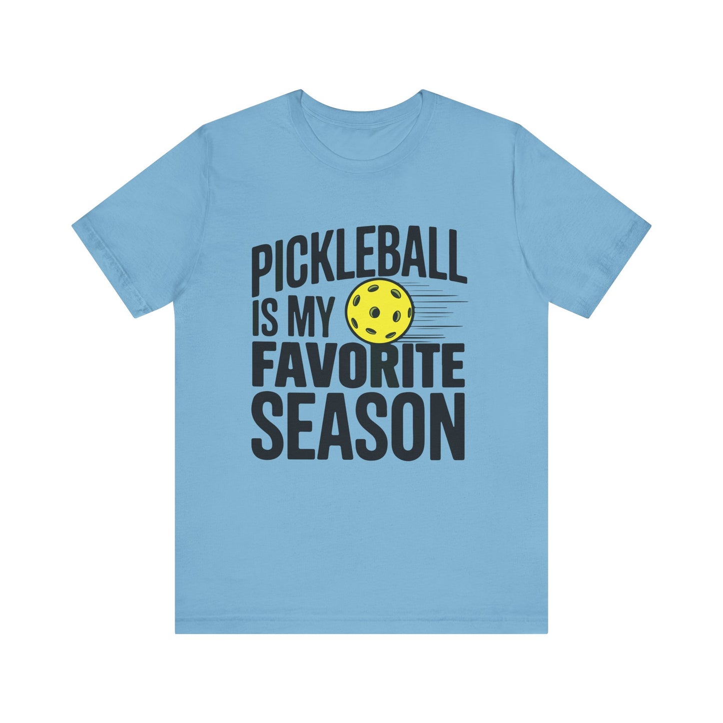 The Pickleball Season T-Shirt displayed in a different color with the same bold text and yellow pickleball graphic.