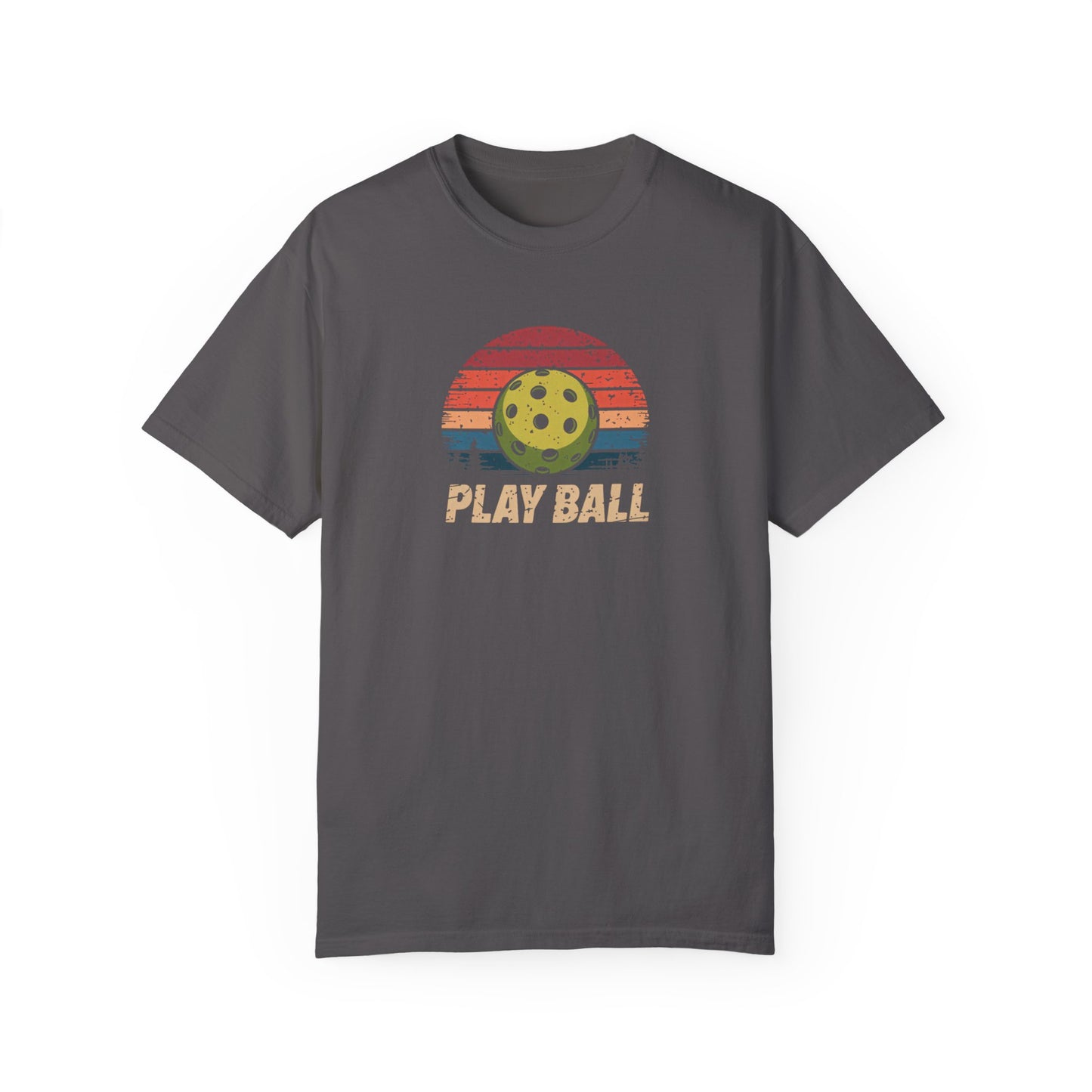 Charcoal-colored t-shirt featuring a distressed retro sunset design with a pickleball at the center and the words “Play Ball” underneath.
